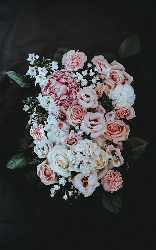 white and pink petaled flower arrangement